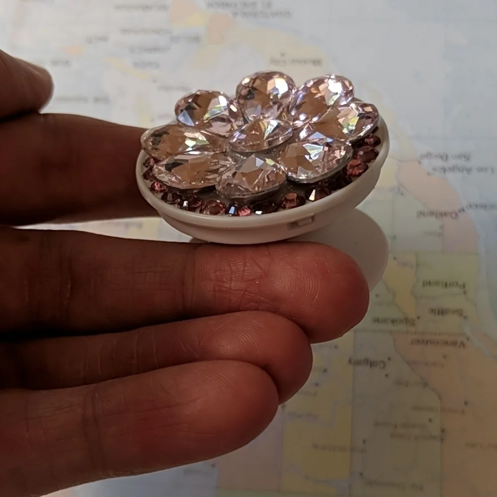 Pink bejeweled phone holder